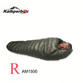 Man in a dark green, puffer-style, mummy-fit sleeping bag with glossy finish