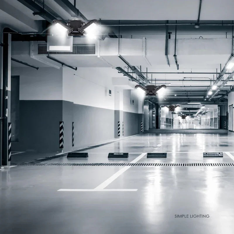 Modern underground parking lot with bright LED ceiling lights and polished concrete floor