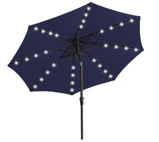 Navy blue outdoor umbrella with LED string lights on ribs, sturdy metal pole, patio setting