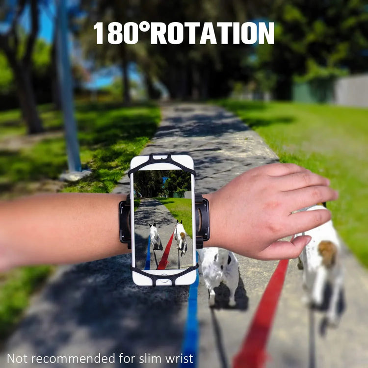 Adjustable black wrist phone holder with 180° rotation worn outdoors on walking path