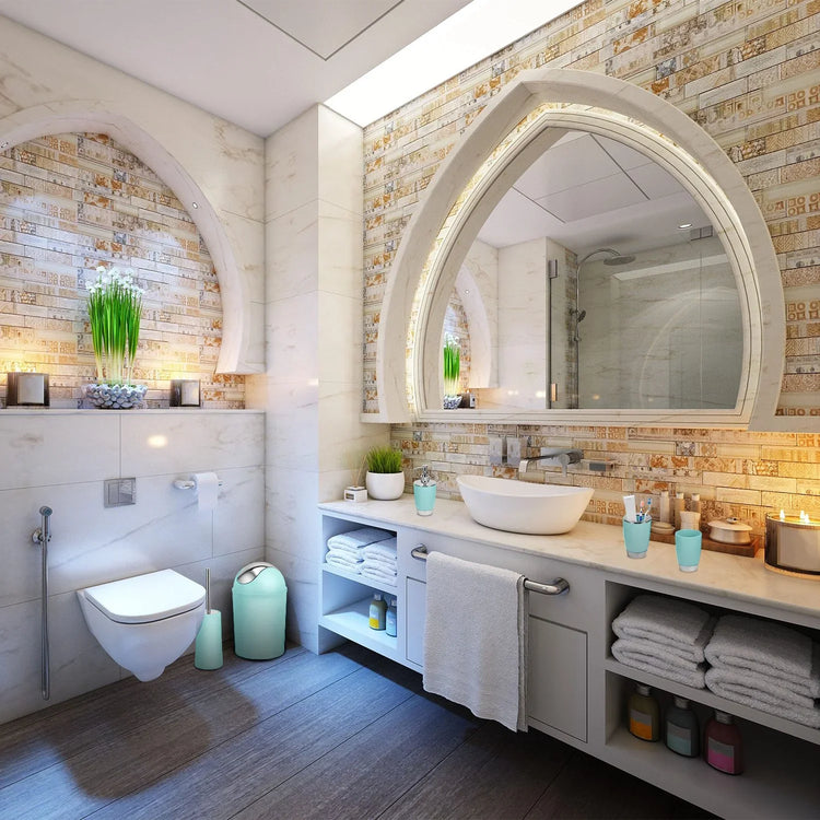 Modern bathroom with white and beige tiles, vessel sink, built-in storage, and decorative plants.