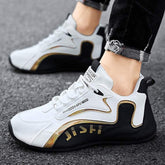 White and black streetwear sneakers with gold accents, synthetic material, athletic fit