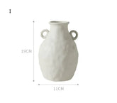 Matte white ceramic vase with twin handles, textured surface, 19cm tall, 11cm wide