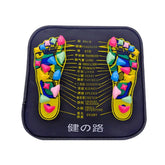 Colorful acupressure foot massage mat with reflexology chart on dark fabric base.