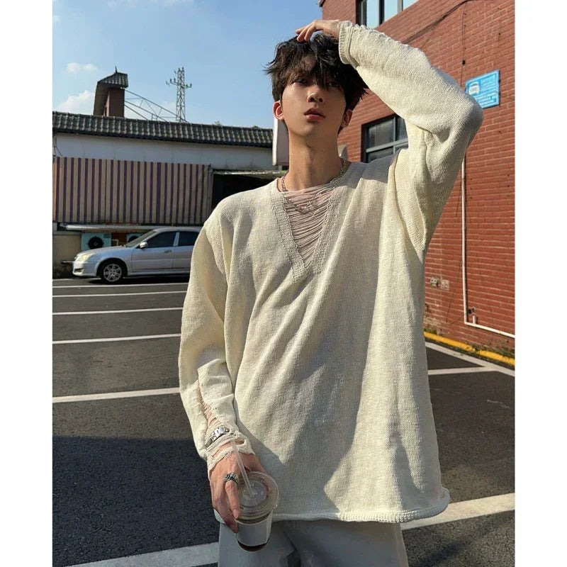 Oversized beige knit sweater with distressed neckline, loose fit streetwear style