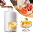 Manual ice crusher with white and gold design, producing fluffy shaved ice desserts.