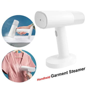 White handheld garment steamer used on pink dress, compact and lightweight for quick wrinkle removal.