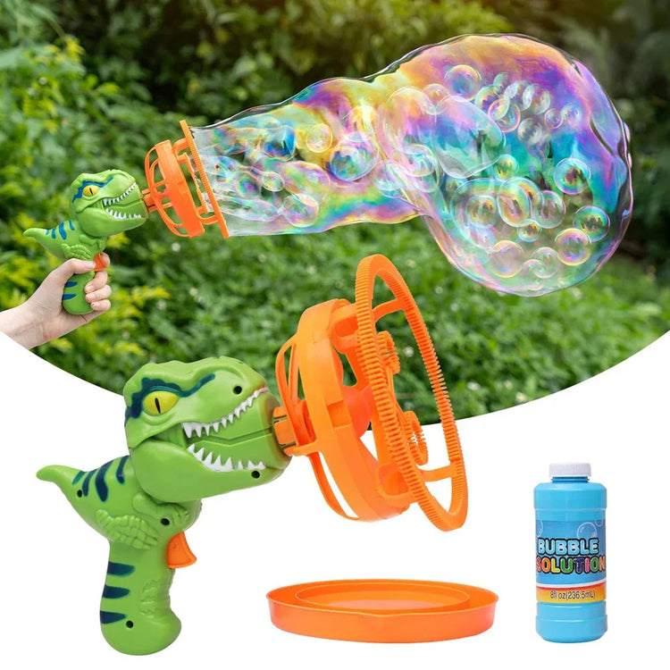 Green dinosaur-shaped bubble gun with orange loop, creating large colorful bubbles outdoors.