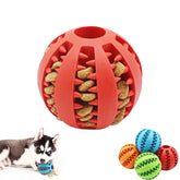 Rubber treat-dispensing ball dog toy in red, shown with kibble and playful puppy.