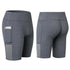 Gray fitted athletic shorts with side pockets, stretchy material, mid-thigh length.