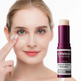 No clothing visible; a woman with clear skin applies a multi balm stick to her face.