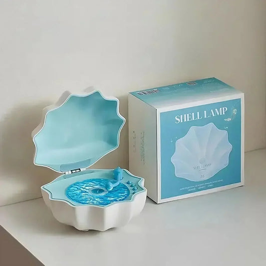 White and blue shell-shaped lamp with glossy interior, modern aesthetic table decor