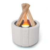 Modern white tabletop electronic fireplace with wood accents and glowing LED flame
