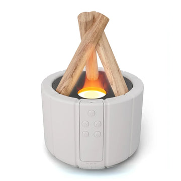Modern white tabletop electronic fireplace with wood accents and glowing LED flame