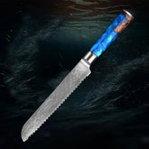 Serrated steel bread knife with a blue resin and wood handle on a dark background