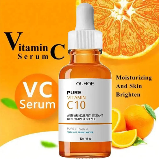 Brown dropper bottle of vitamin C serum with white cap, orange background and citrus fruits.