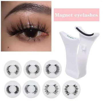 Set of black magnetic false eyelashes with curved eyelash applicator tool on white background