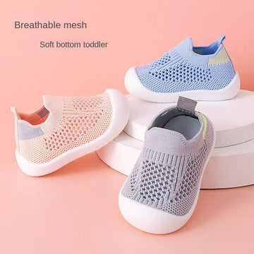 Breathable mesh slip-on toddler shoes in pastel blue, peach, and gray with soft rubber soles