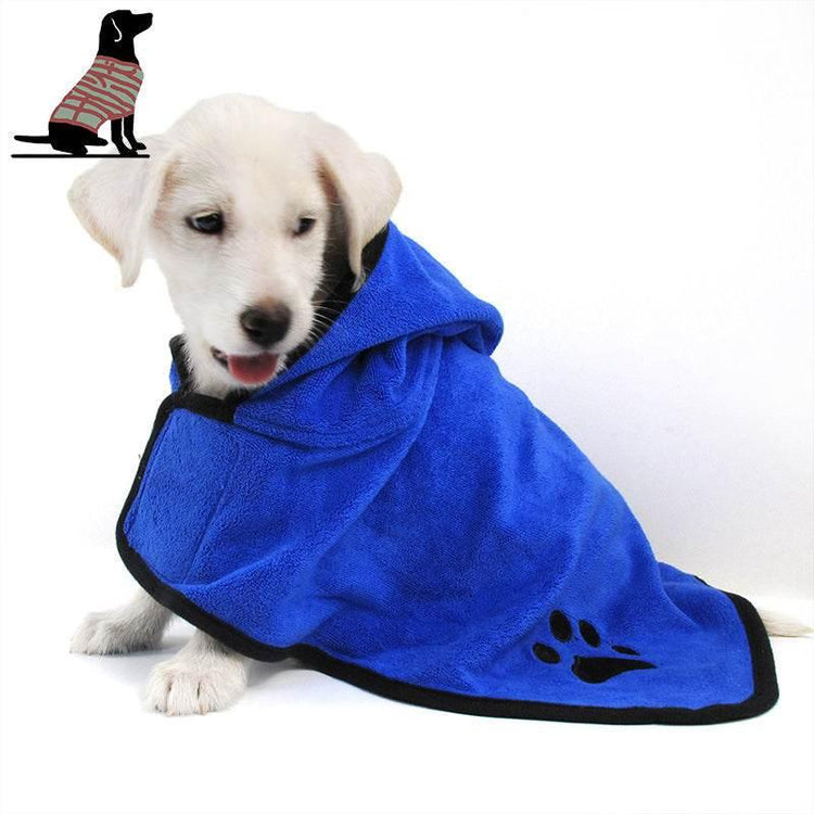 Puppy wearing a blue hooded fleece dog coat with black trim and paw print detail, cozy fit