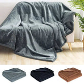 Waterproof Blanket soft cozy fabric in gray black and brown colors on sofa and folded neatly