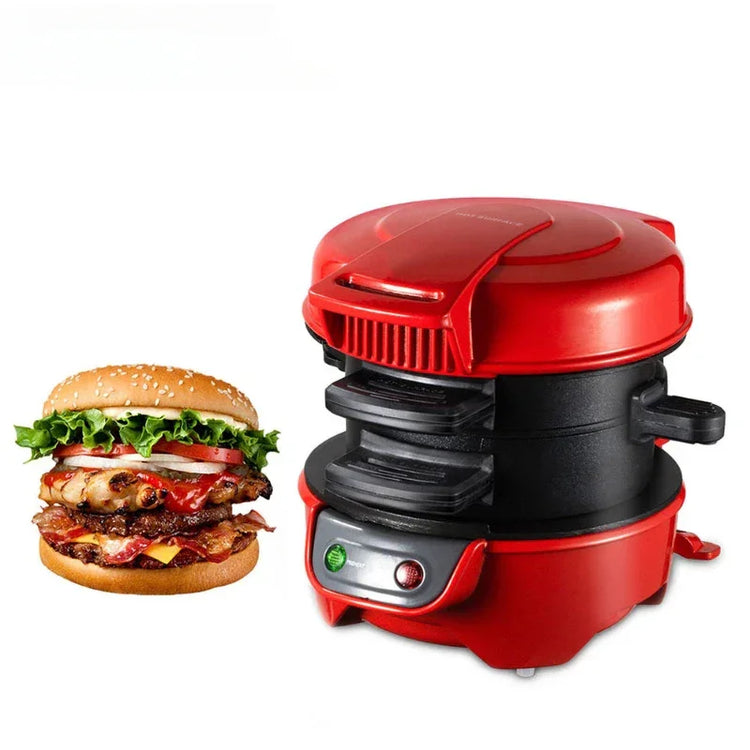 Red electric burger maker with non-stick plates next to a stacked cheeseburger