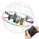 Hand holding remote controls LED-lit drone in white protective cage, minimalist background