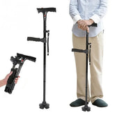Man wearing light blue shirt and beige pants modeling adjustable black folding walking cane with ergonomic handle and rubber base.