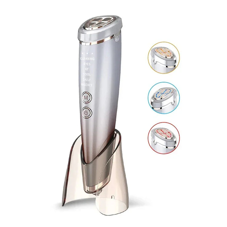 Silver handheld skincare device on stand with LED light color options, modern minimalist design.