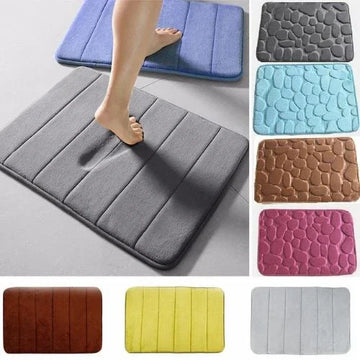 Memory foam bath mats in assorted colors and patterns, soft texture, absorbent, rectangular design.