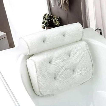 White padded mesh bath pillow with ergonomic head and neck support on bathtub