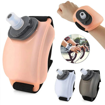 Adjustable silicone wrist water bottle in pink, white, and black, shown worn on wrist, ideal for cyclists and runners.