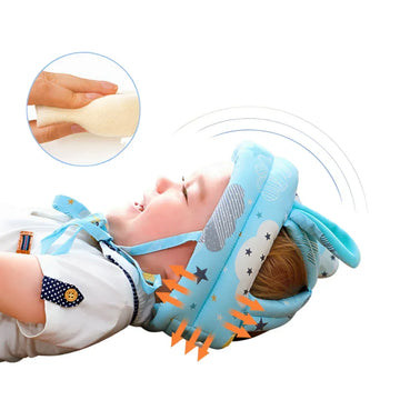Baby wearing soft blue protective helmet with cloud and star print, adjustable fit.