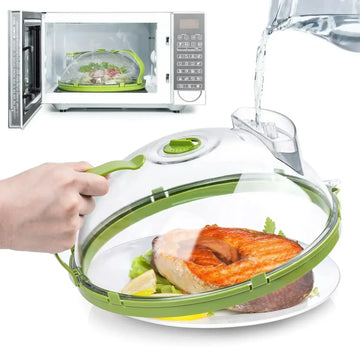 Microwave food steamer with clear plastic dome and green accents, cooking salmon and vegetables