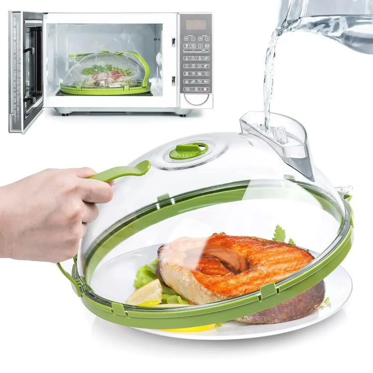 Microwave food steamer with clear plastic dome and green accents, cooking salmon and vegetables