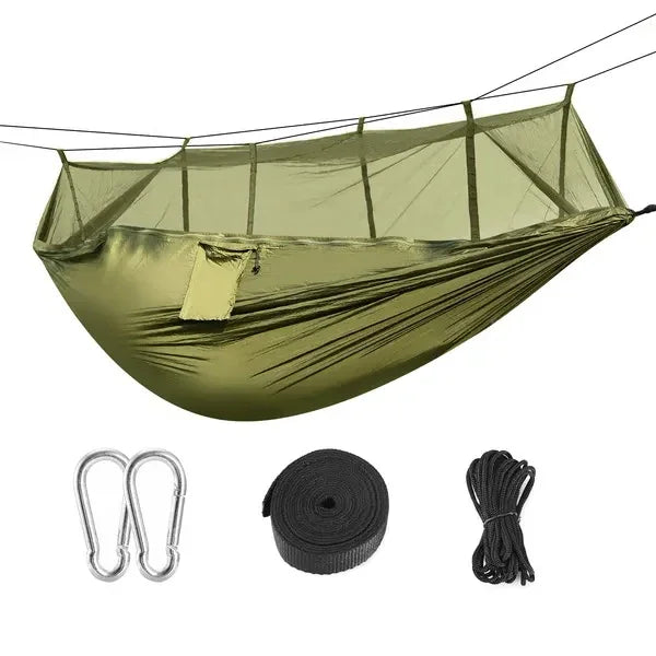 Olive green nylon hammock with mosquito net, carabiners, strap, and rope for outdoor camping.