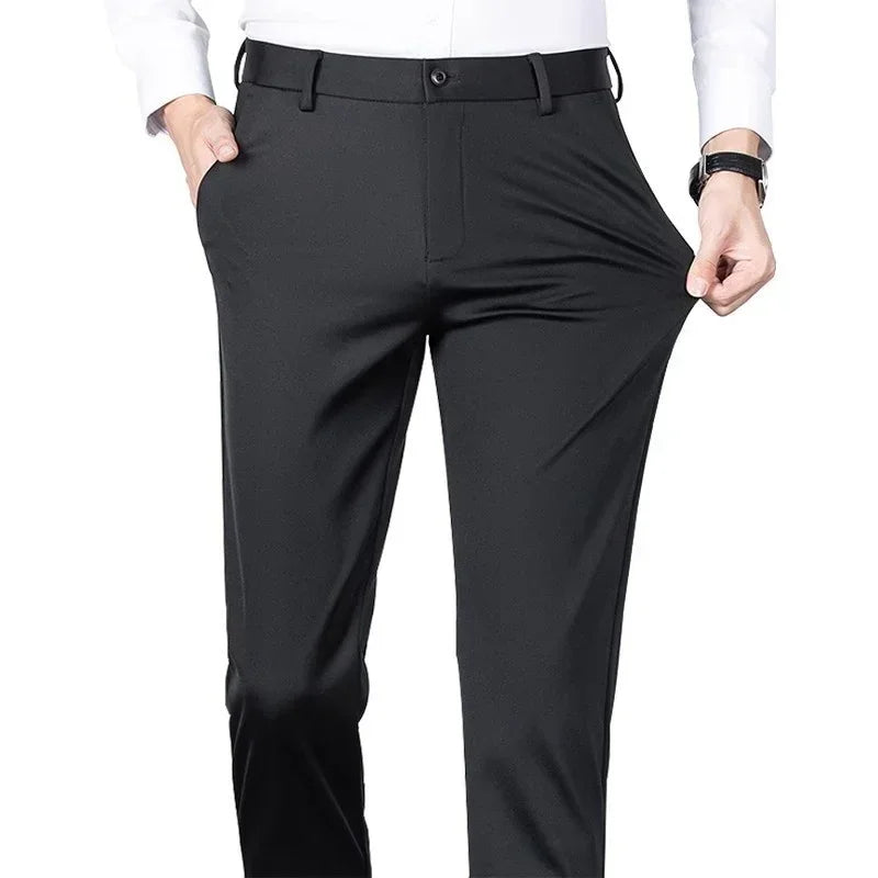 Slim fit black stretch dress pants with flexible waist, worn with white shirt