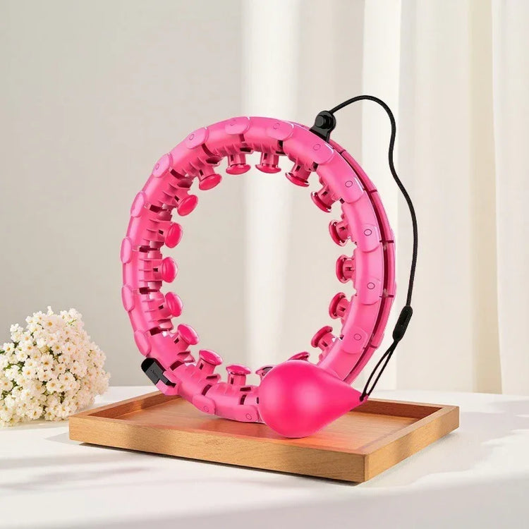 Pink adjustable plastic fitness hoop with massage nodes, weighted ball, modern design