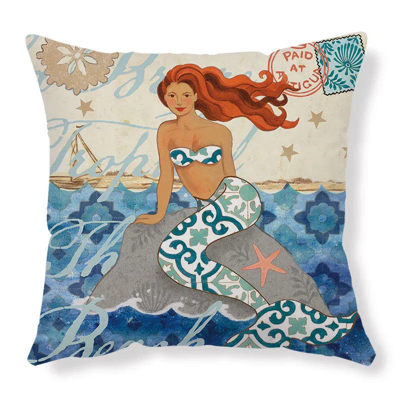 Decorative pillow with a colorful mermaid illustration, blue patterned tail, and ocean background.