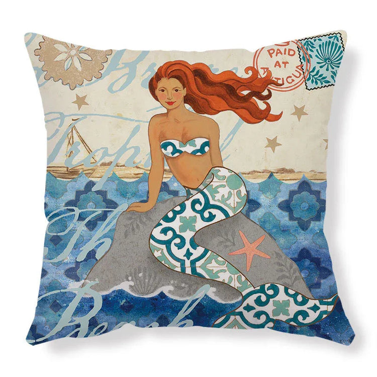 Decorative pillow with a colorful mermaid illustration, blue patterned tail, and ocean background.