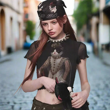 Woman in sheer black crop top with cat graphic, olive pants, and spiked choker streetwear