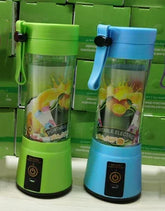 Green and blue portable electric blenders with clear plastic bodies and touch power buttons