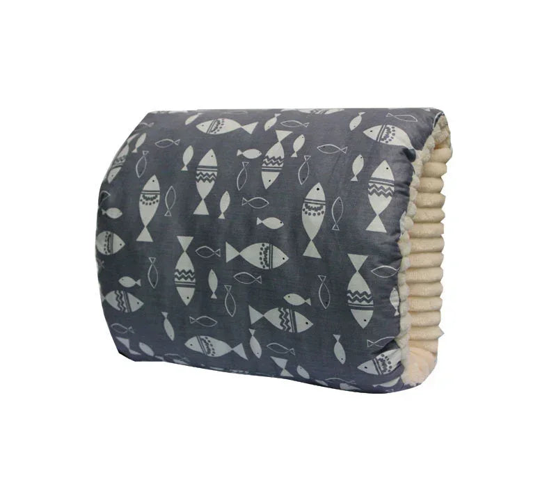 Gray cushion with white fish print, soft ribbed sides, rectangular shape, cozy fabric