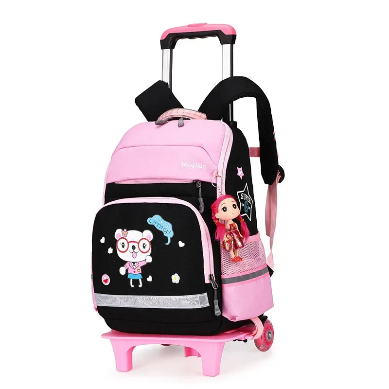 Pink and black wheeled children's backpack with cartoon bear design and doll keychain