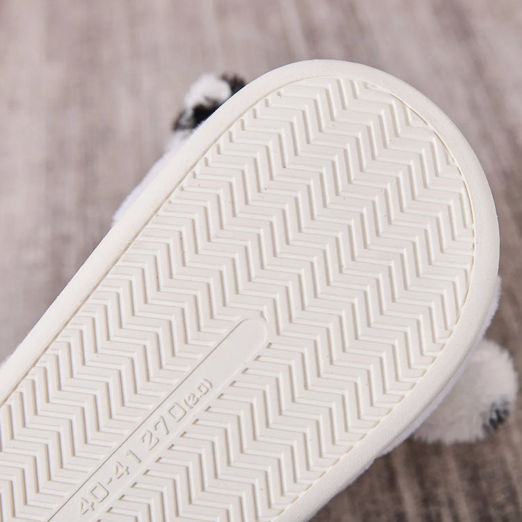 Close-up of white rubber sole with herringbone tread pattern on footwear