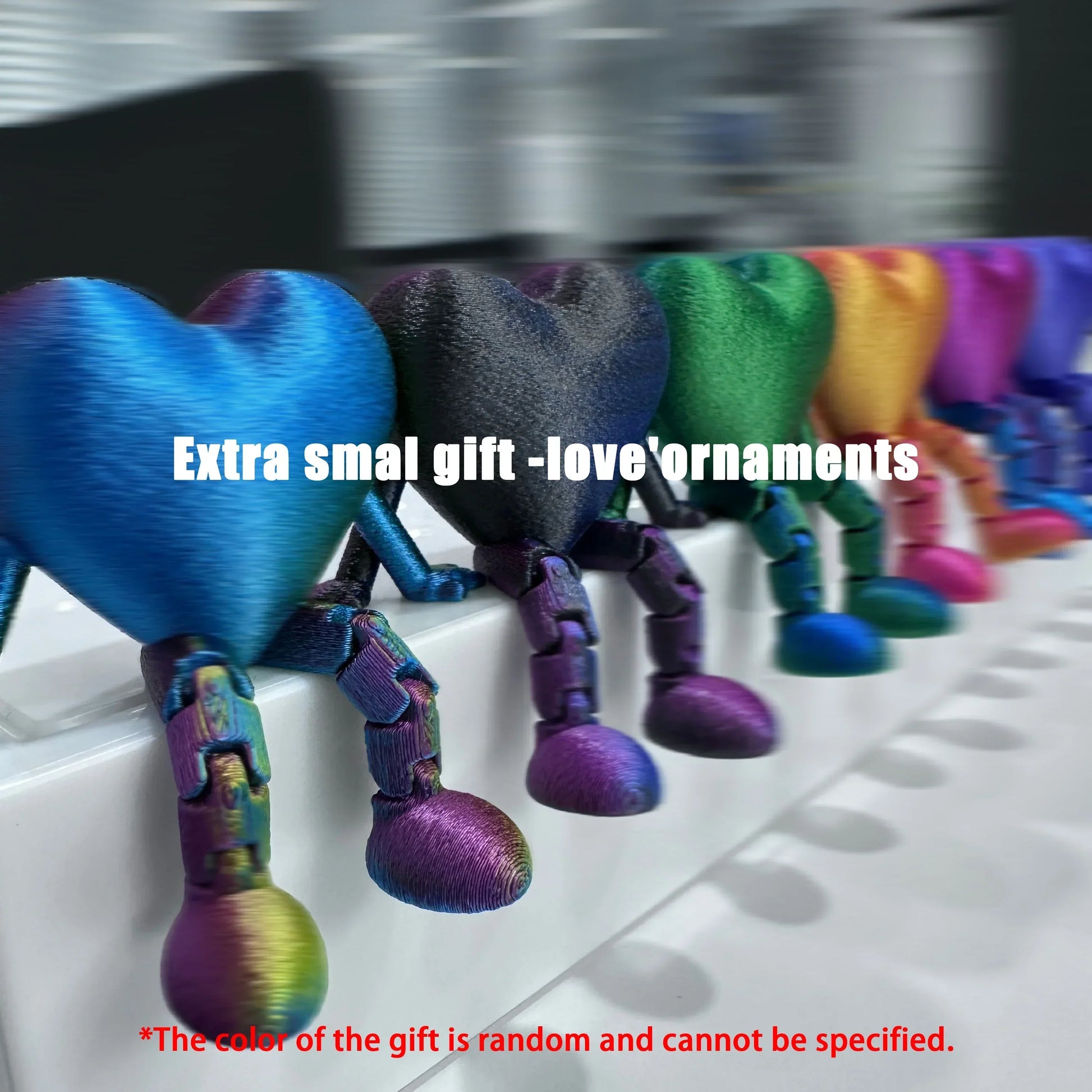Colorful heart-shaped figurines with jointed legs, smooth matte material, small size, assorted colors