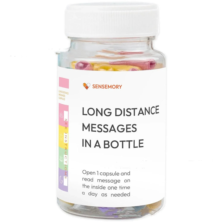 Clear plastic bottle with colorful capsules labeled for long distance messages