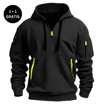 Black streetwear hoodie with yellow zipper accents, utility pockets, relaxed fit