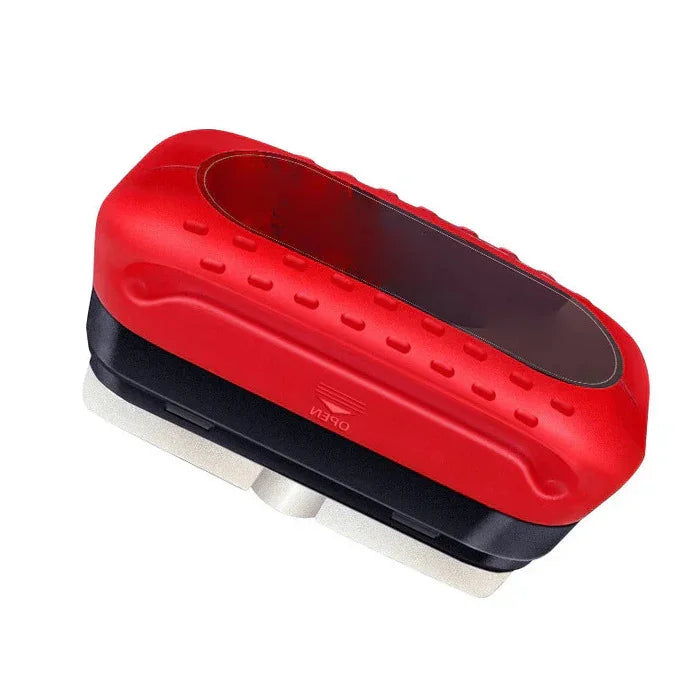 Red and black ergonomic handheld cleaning brush with a rubberized grip and stainless steel base