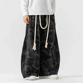 Loose fit black tie-dye wide leg pants with white rope belt, streetwear style