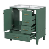 Green bathroom vanity cabinet with open drawers and doors, white countertop, modern hardware